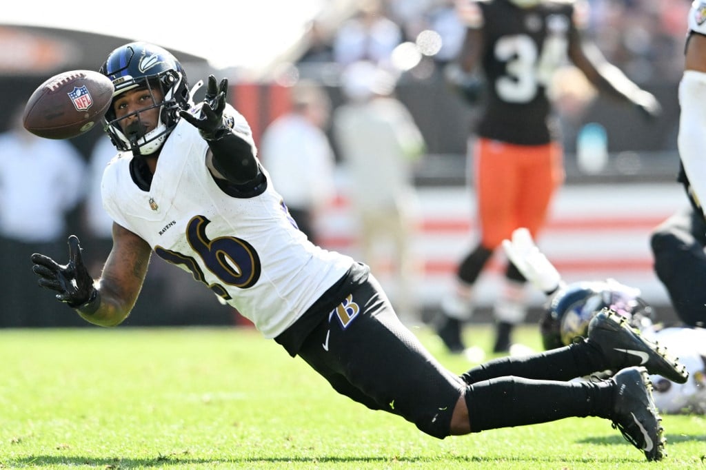 Lamar winless no more, leads Ravens to 20-13 win over Titans