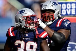 Rhamondre Stevenson and Caedan Wallace New England Patriots